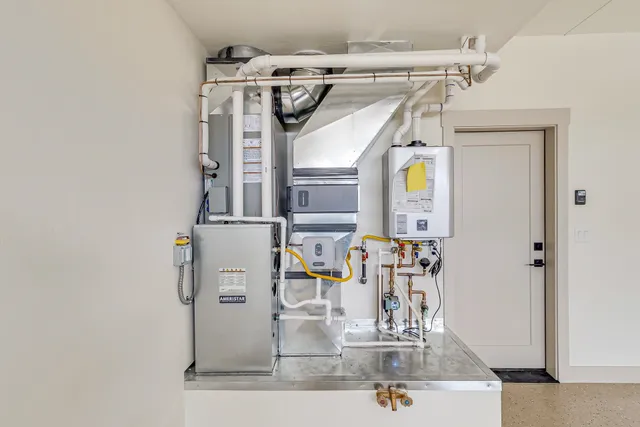a view of open kitchen with granite countertop a stove and a wooden floors