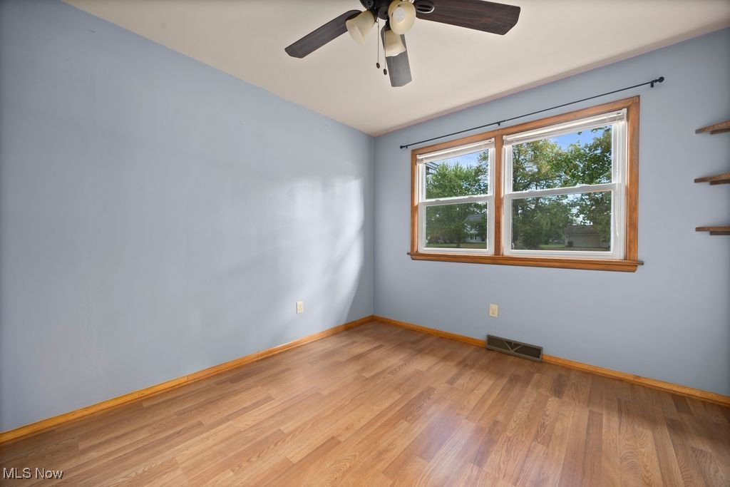 5956 Ryan Road Medina, OH 44256 - Photo 11 of 27 Empty room featuring light wood-type flooring and a ceiling fan