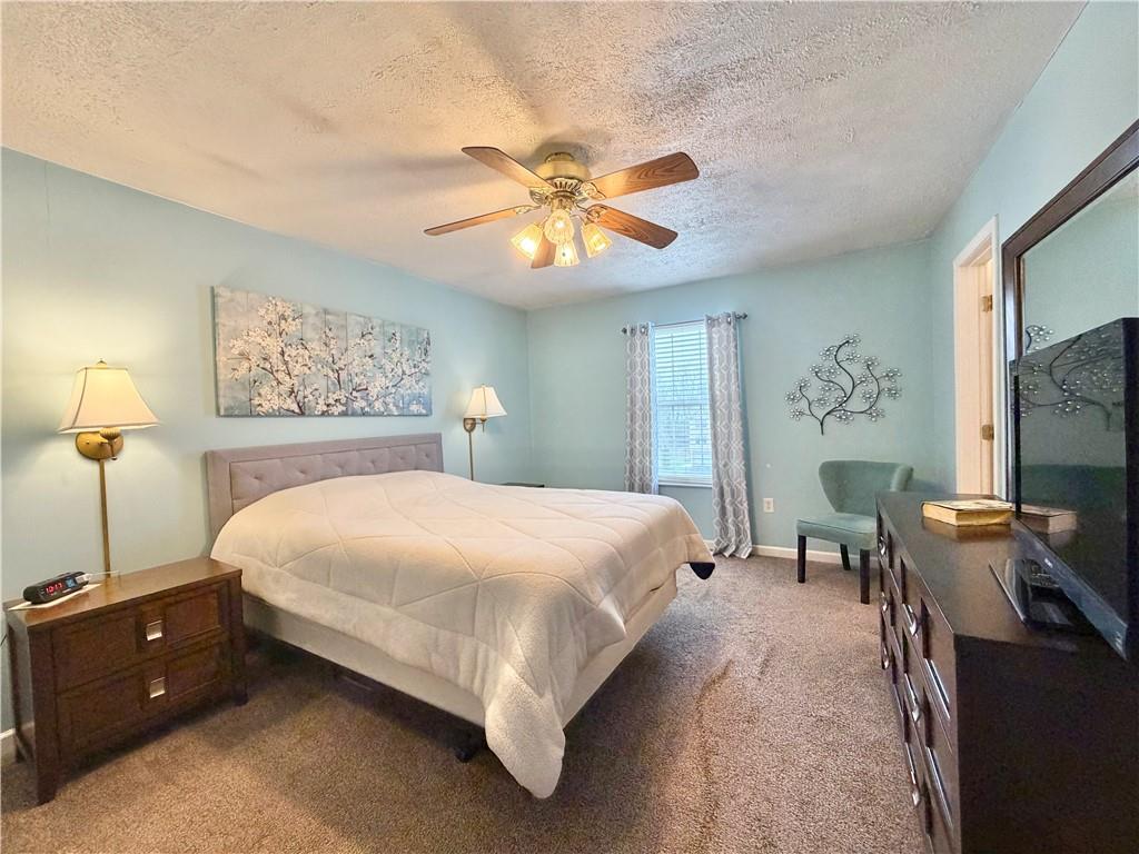213 Manor View Drive Manor, PA 15665 - Photo 17 of 33 a bedroom with a bed and a chandelier