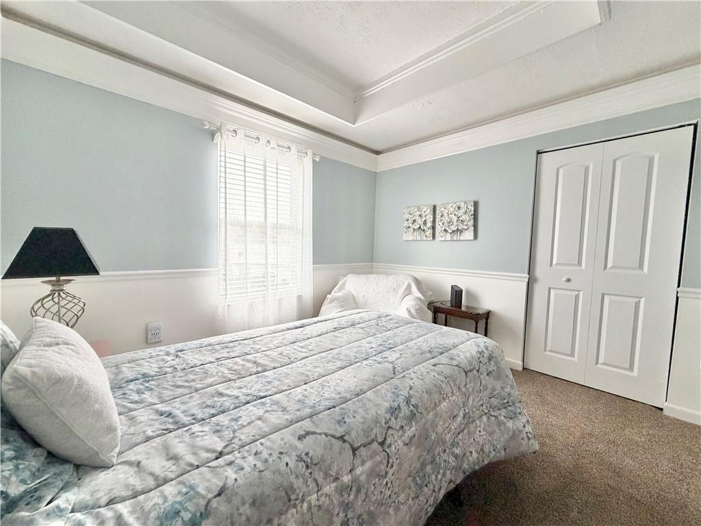 213 Manor View Drive Manor, PA 15665 - Photo 23 of 33 a bedroom with a large bed and a window