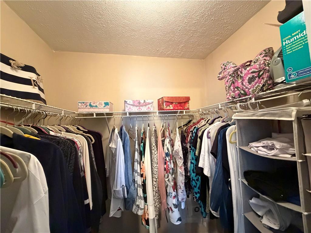 213 Manor View Drive Manor, PA 15665 - Photo 25 of 33 a view of walk in closet with clothes and shoes