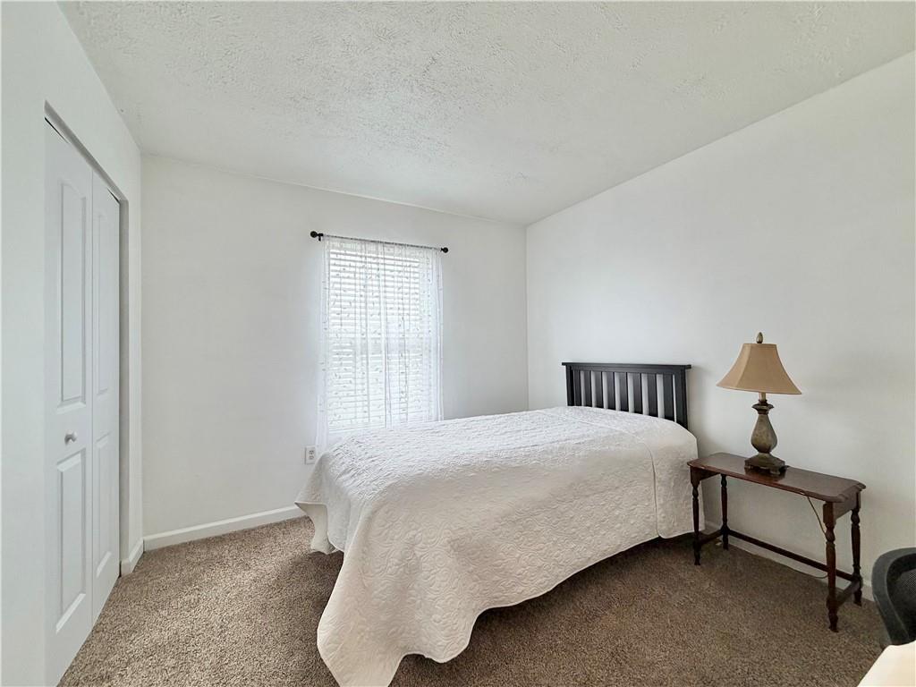 213 Manor View Drive Manor, PA 15665 - Photo 29 of 33 a bedroom with a bed and a window
