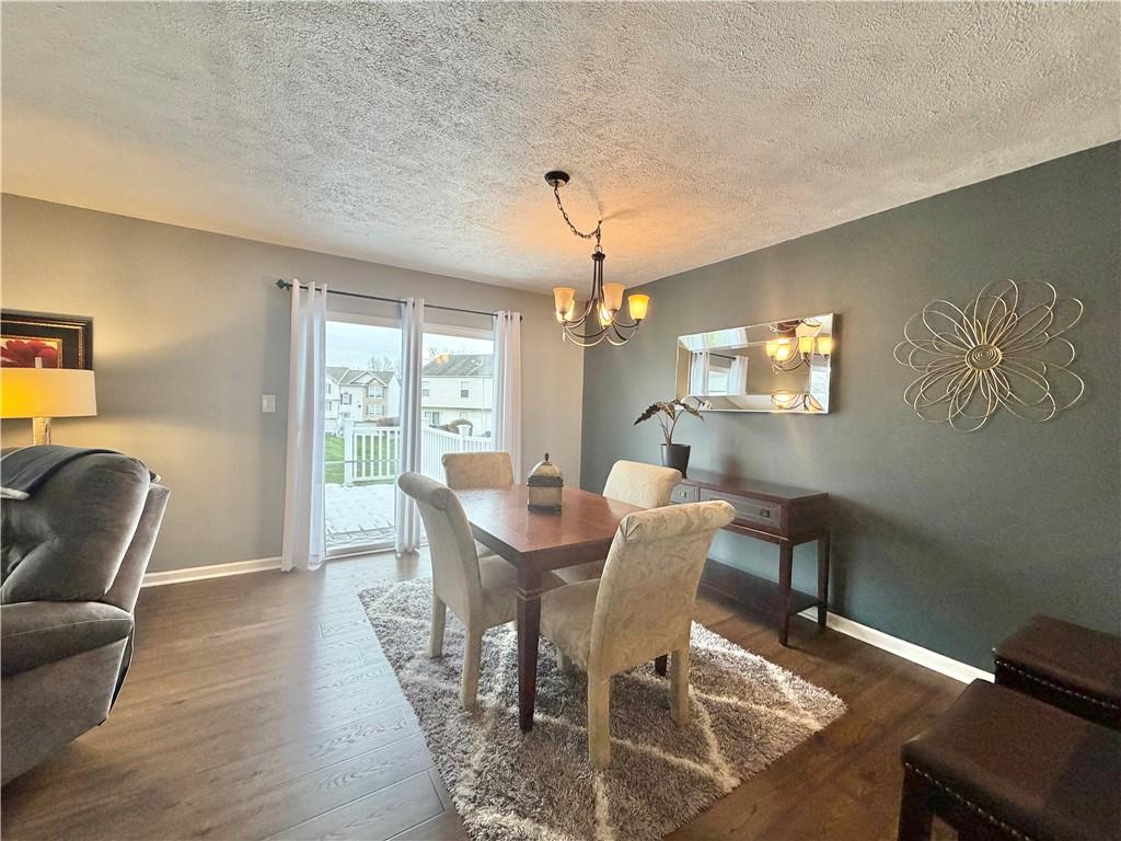 213 Manor View Drive Manor, PA 15665 - Photo 5 of 33 a view of a dining room with furniture window and wooden floor
