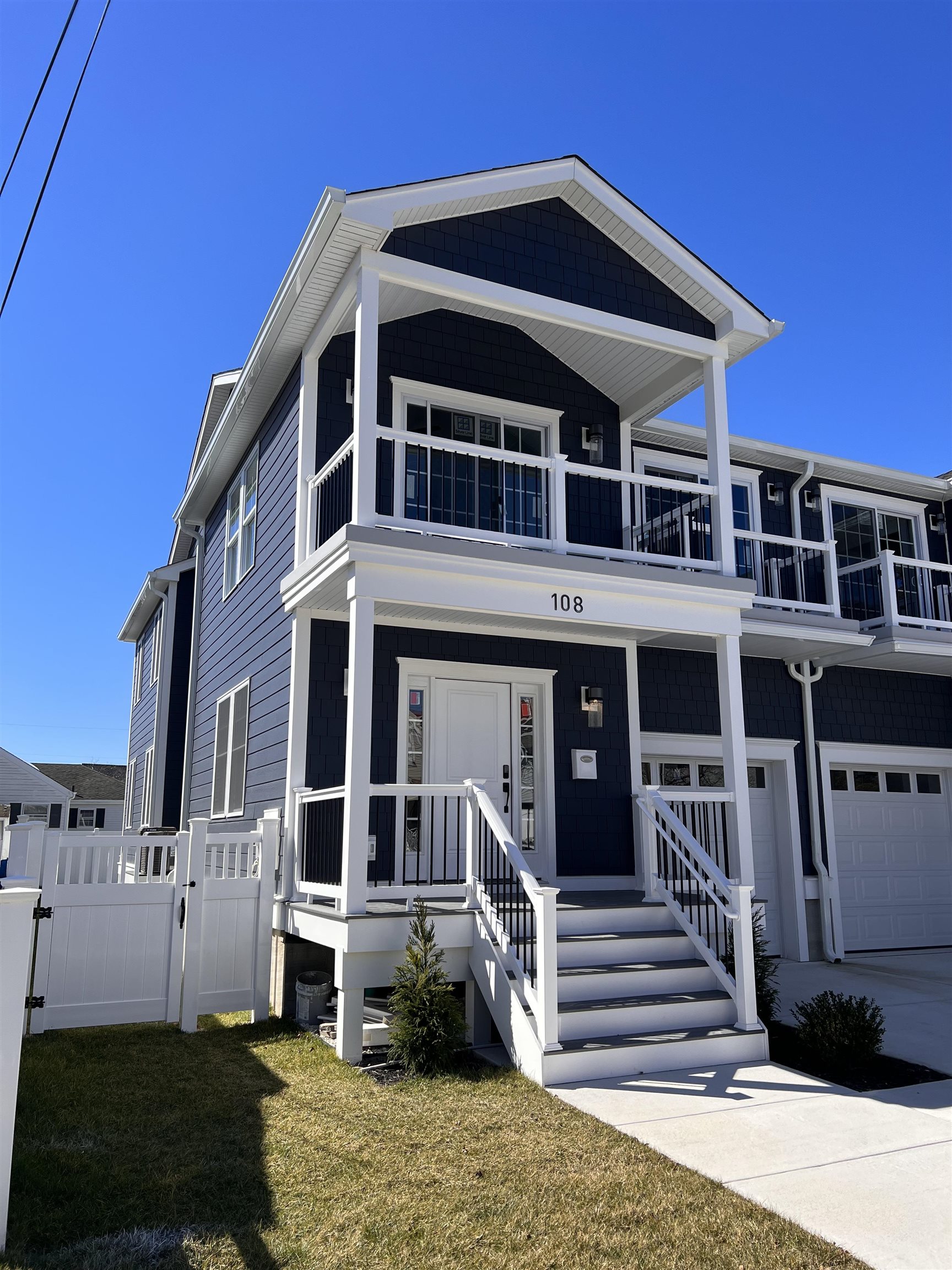 108 East Fern Road Wildwood Crest, NJ 08260 - Photo 1 of 9 a front view of a house with a yard