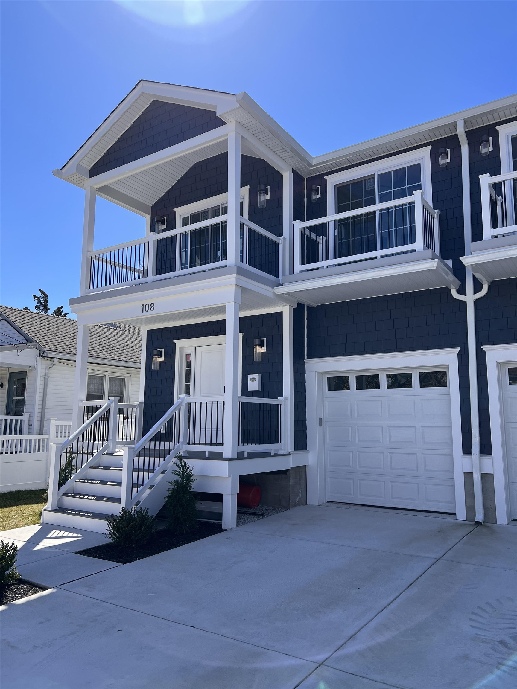 108 East Fern Road Wildwood Crest, NJ 08260 - Photo 2 of 9 a view of a house with a balcony and wooden floor