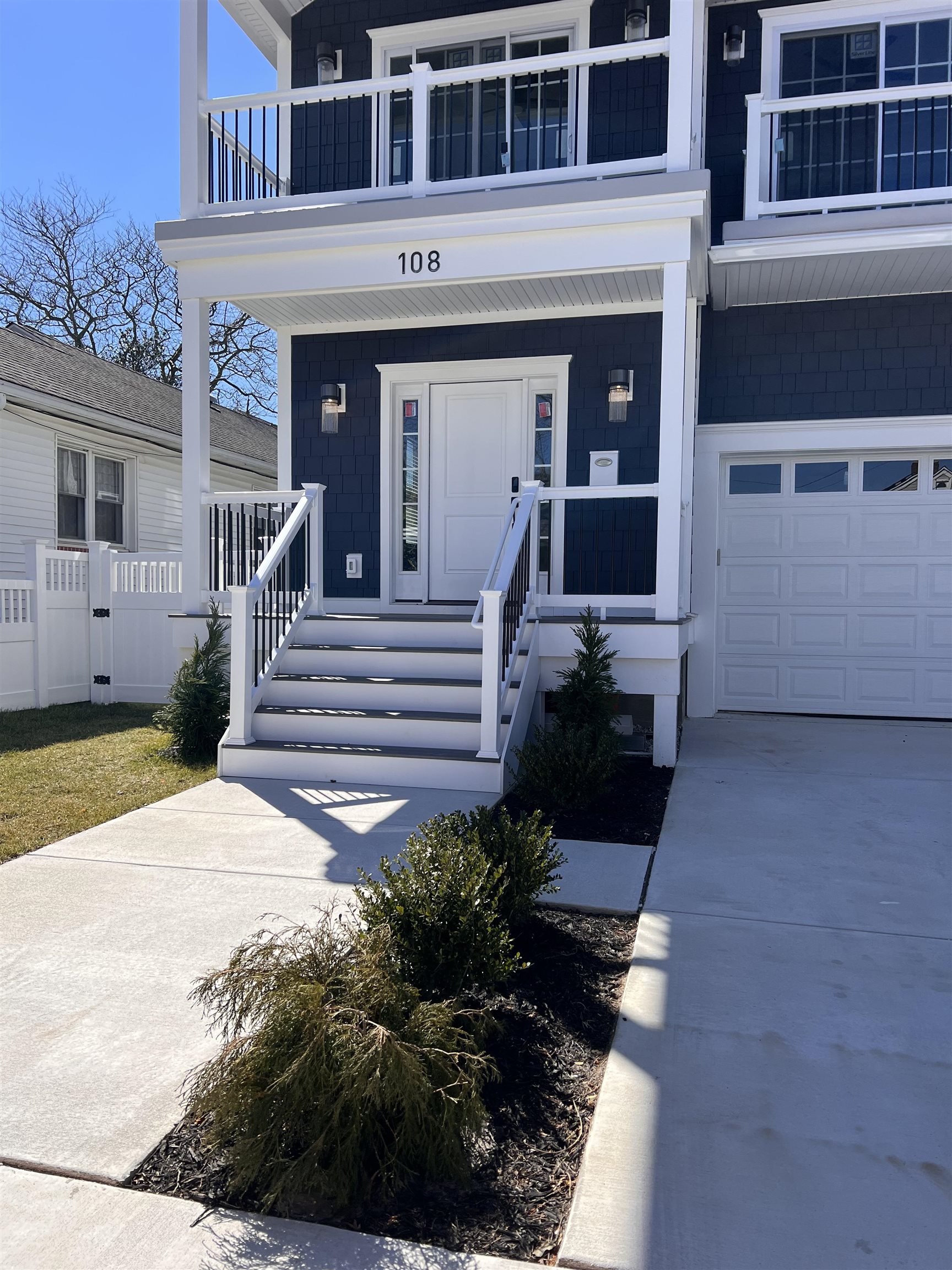 108 East Fern Road Wildwood Crest, NJ 08260 - Photo 4 of 9 a front view of a house with a garden