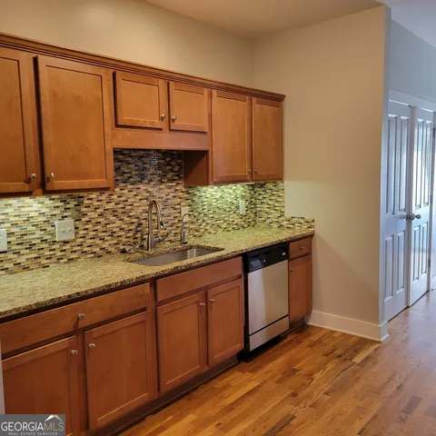 a bathroom with a double vanity sink a and a mirror