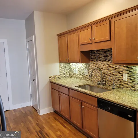 a bathroom with double vanity sink and a mirror