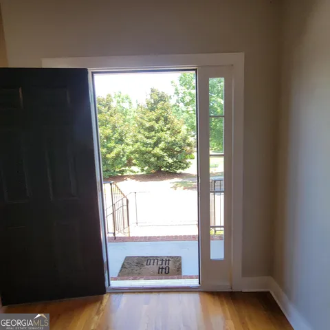 a picture of a bench in front of a house