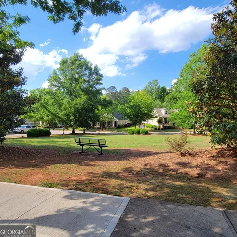 a view of an empty room with a fireplace