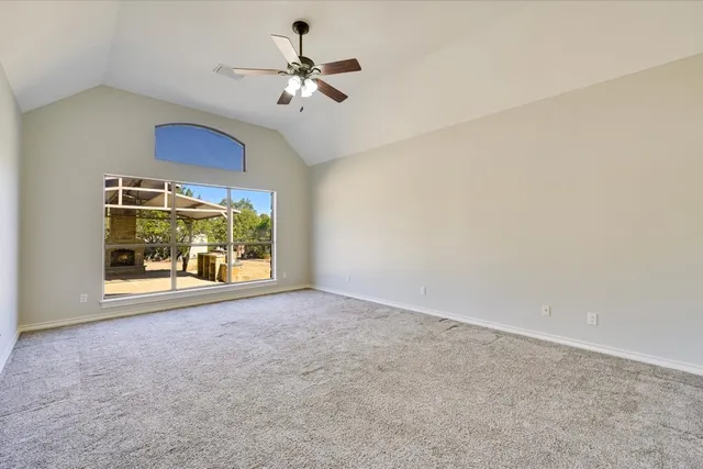 a view of empty room with a fireplace