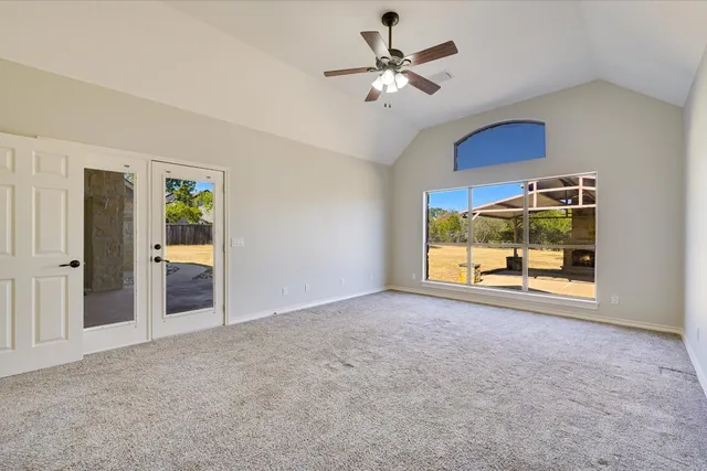 a spacious bathroom with a tub sink and mirror