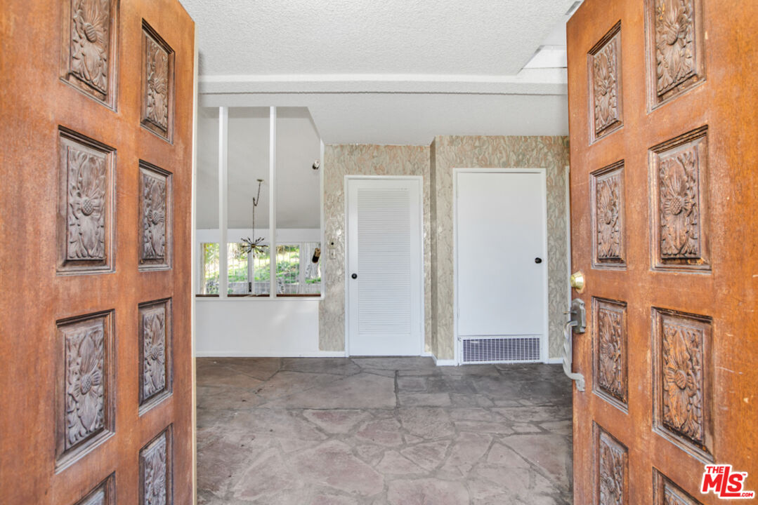 5272 Veronica Street Los Angeles, CA 90008 - Photo 12 of 51 a view of an entryway with wooden floor and a living room