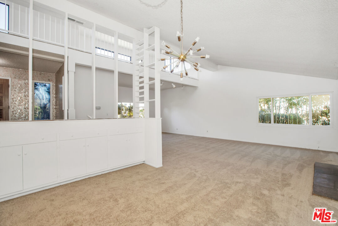 5272 Veronica Street Los Angeles, CA 90008 - Photo 19 of 51 a view of a living room and chandelier