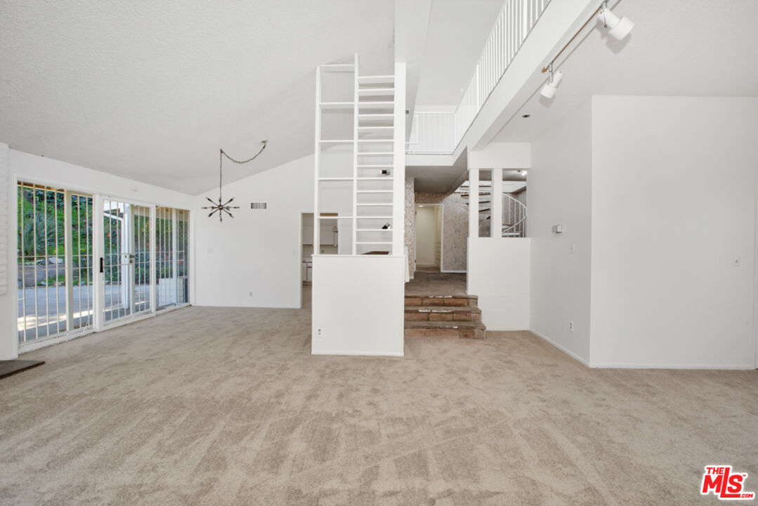 5272 Veronica Street Los Angeles, CA 90008 - Photo 23 of 51 a view of an empty room with stairs