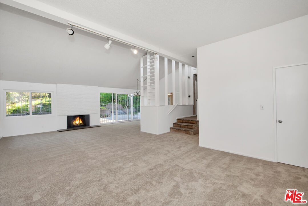 5272 Veronica Street Los Angeles, CA 90008 - Photo 24 of 51 a view of a livingroom with an empty space and a fireplace