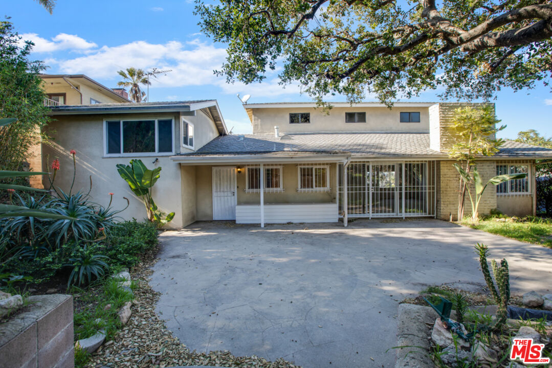 5272 Veronica Street Los Angeles, CA 90008 - Photo 38 of 51 a front view of a house with garden