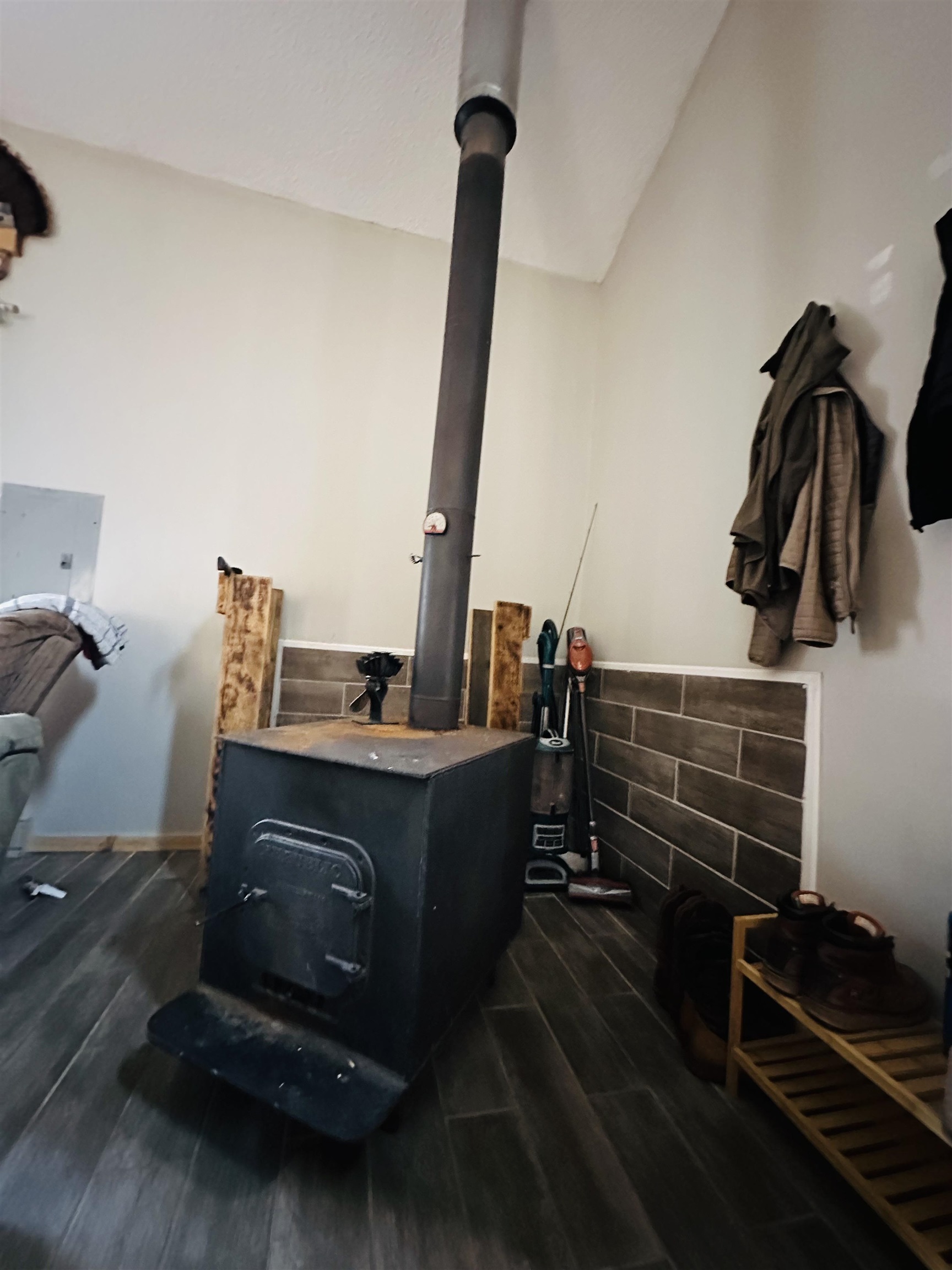 6955 Kolling Road Iron River, WI 54847 - Photo 8 of 22 Detailed view of a wood stove and wood finished floors