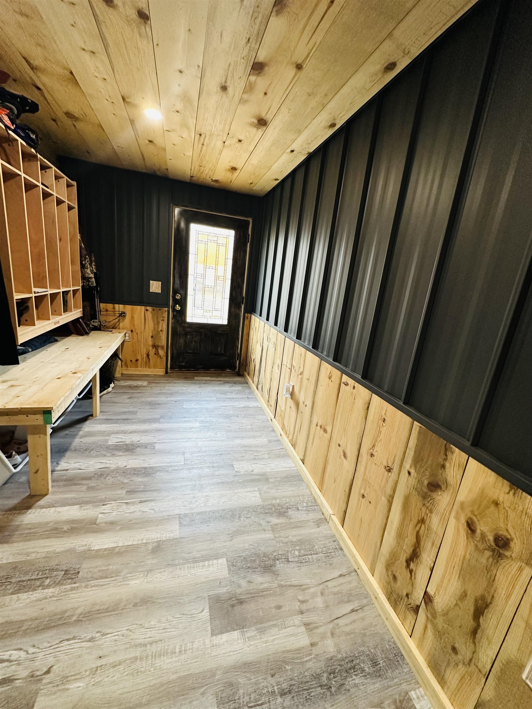 6955 Kolling Road Iron River, WI 54847 - Photo 10 of 22 Mudroom with wooden walls, wood finished floors, and wood ceiling