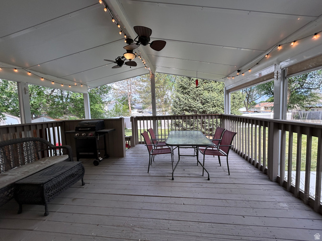 7659 State Street Midvale, UT 84047 - Photo 26 of 33 Deck featuring outdoor dining area, a ceiling fan, and area for grilling