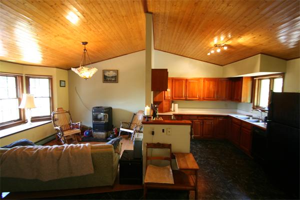 352 Montague Road Sunderland, MA 01375 - Photo 9 of 27 a room with furniture and a chandelier