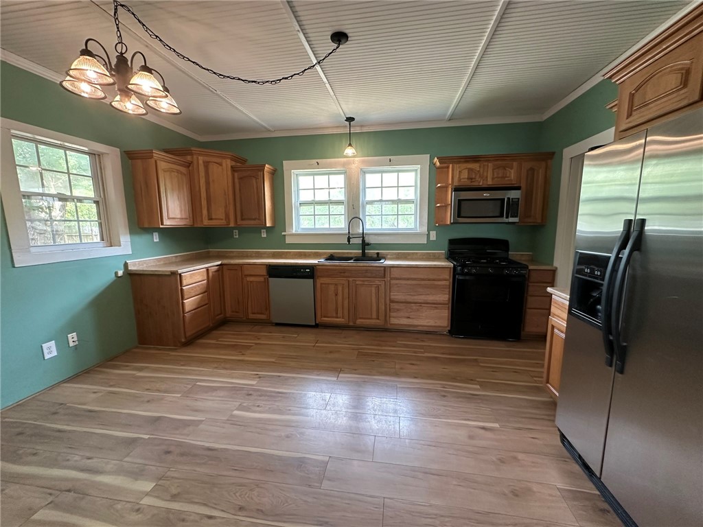 131 Dell Street Portland, TX 78374 - Photo 13 of 40 a large kitchen with stainless steel appliances granite countertop a sink stove and refrigerator