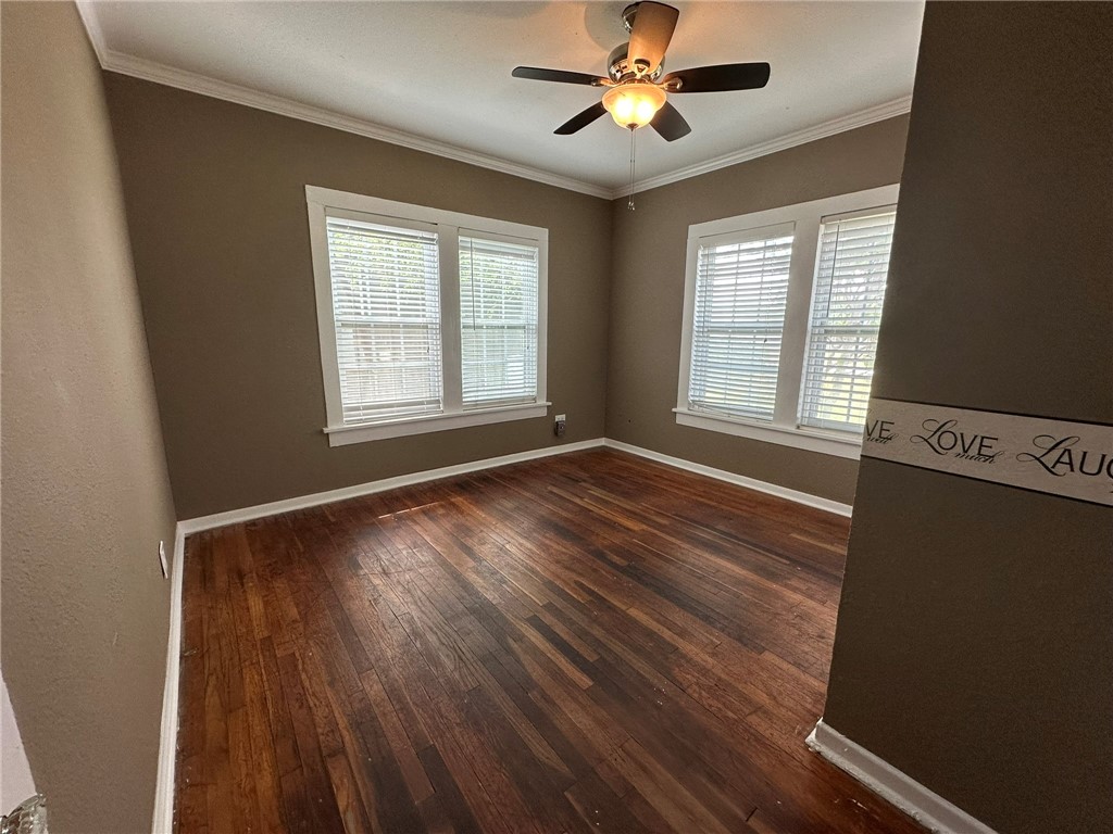 131 Dell Street Portland, TX 78374 - Photo 19 of 40 a view of an empty room with wooden floor and a window