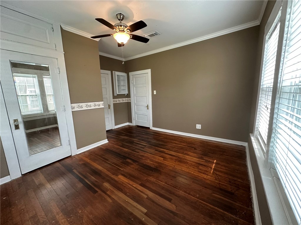 131 Dell Street Portland, TX 78374 - Photo 21 of 40 a view of empty room with wooden floor and fan