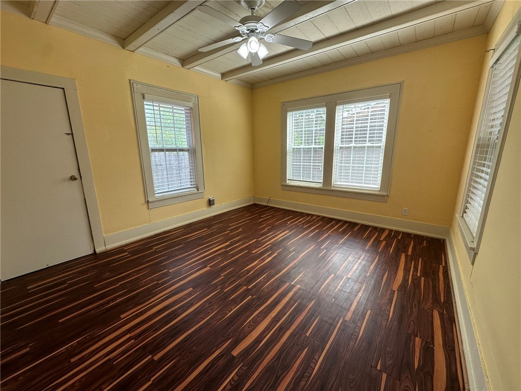 131 Dell Street Portland, TX 78374 - Photo 23 of 40 a view of an empty room with wooden floor and a window