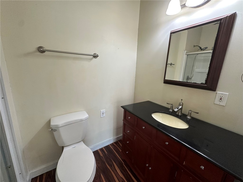 131 Dell Street Portland, TX 78374 - Photo 28 of 40 a bathroom with a toilet sink and mirror
