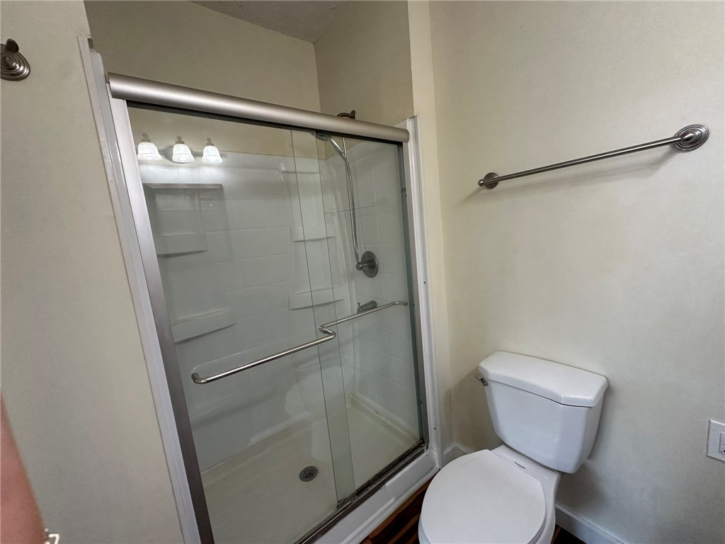 131 Dell Street Portland, TX 78374 - Photo 29 of 40 a bathroom with a toilet and a shower