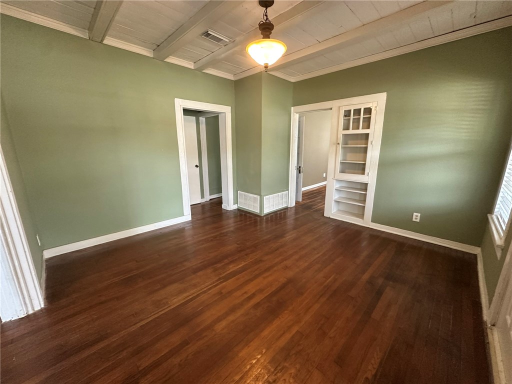 131 Dell Street Portland, TX 78374 - Photo 3 of 40 an empty room with wooden floor closet and windows