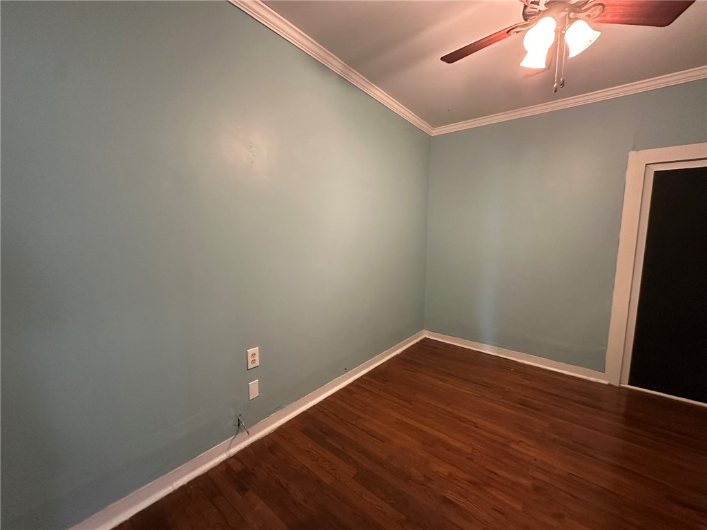131 Dell Street Portland, TX 78374 - Photo 35 of 40 an empty room with wooden floor and windows