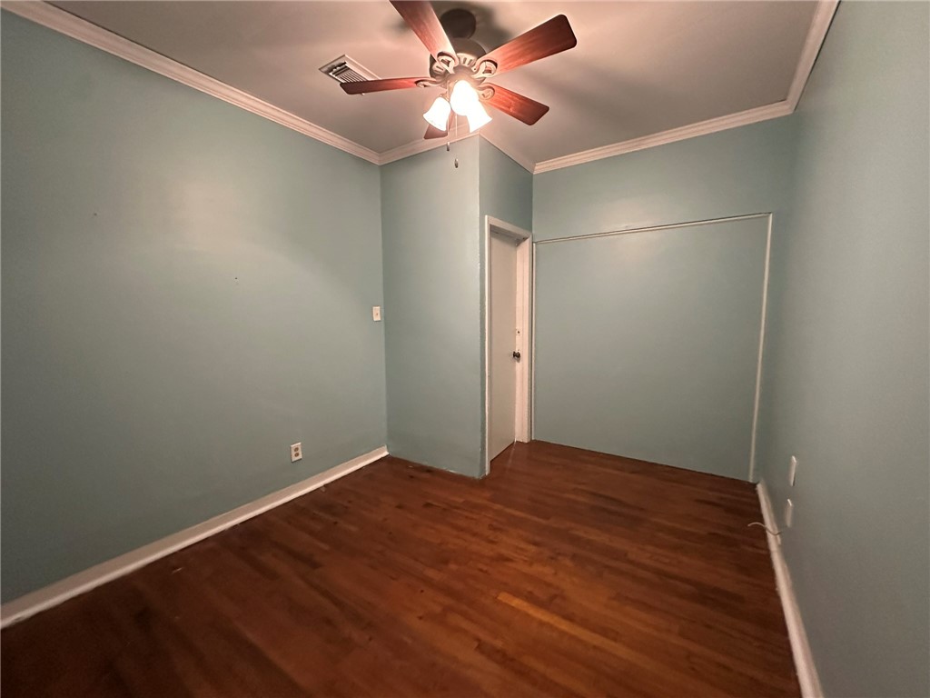 131 Dell Street Portland, TX 78374 - Photo 37 of 40 an empty room with closet and a chandelier fan