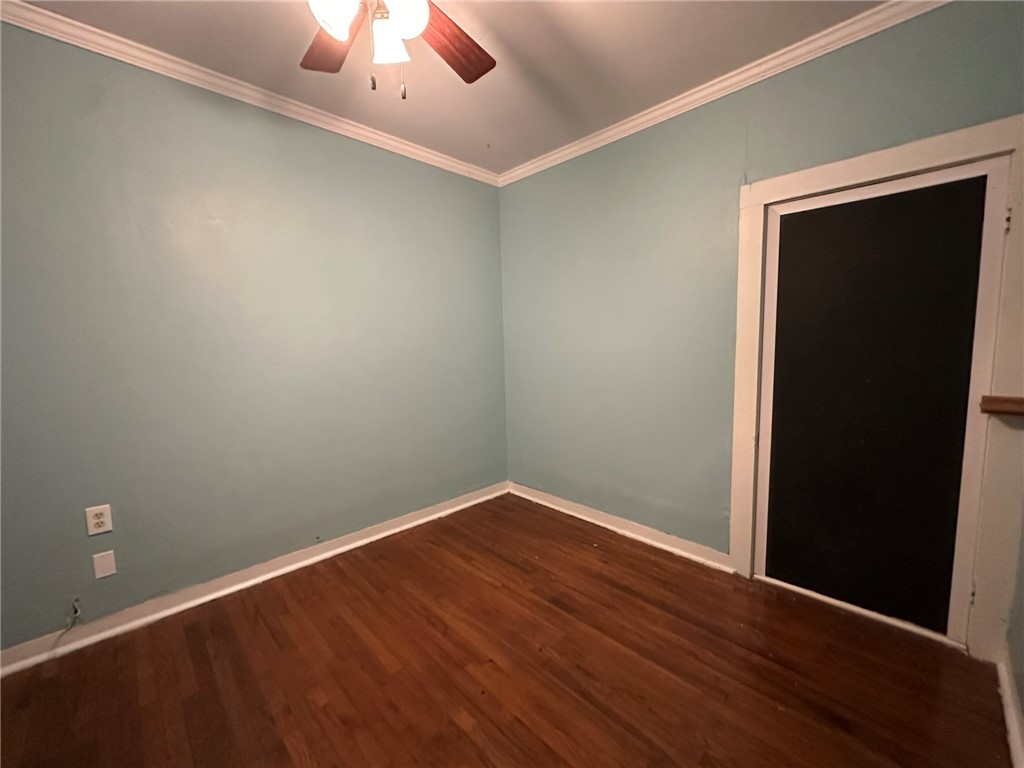 131 Dell Street Portland, TX 78374 - Photo 39 of 40 an empty room with a hardwood and a ceiling fan