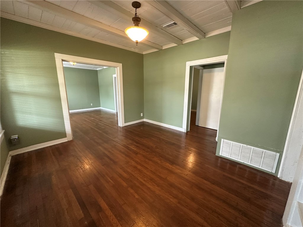131 Dell Street Portland, TX 78374 - Photo 4 of 40 an empty room with wooden floor and closet