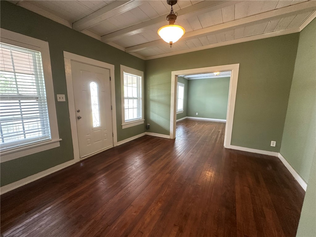 131 Dell Street Portland, TX 78374 - Photo 5 of 40 an empty room with wooden floor and windows