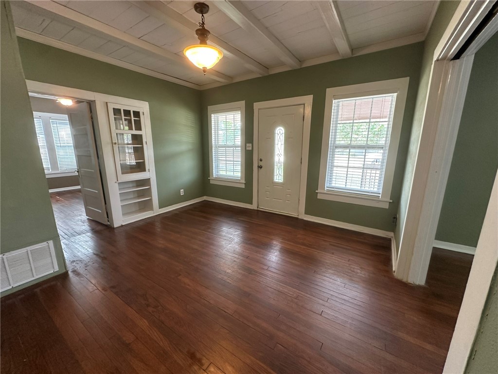 131 Dell Street Portland, TX 78374 - Photo 6 of 40 a view of an empty room with wooden floor and a window