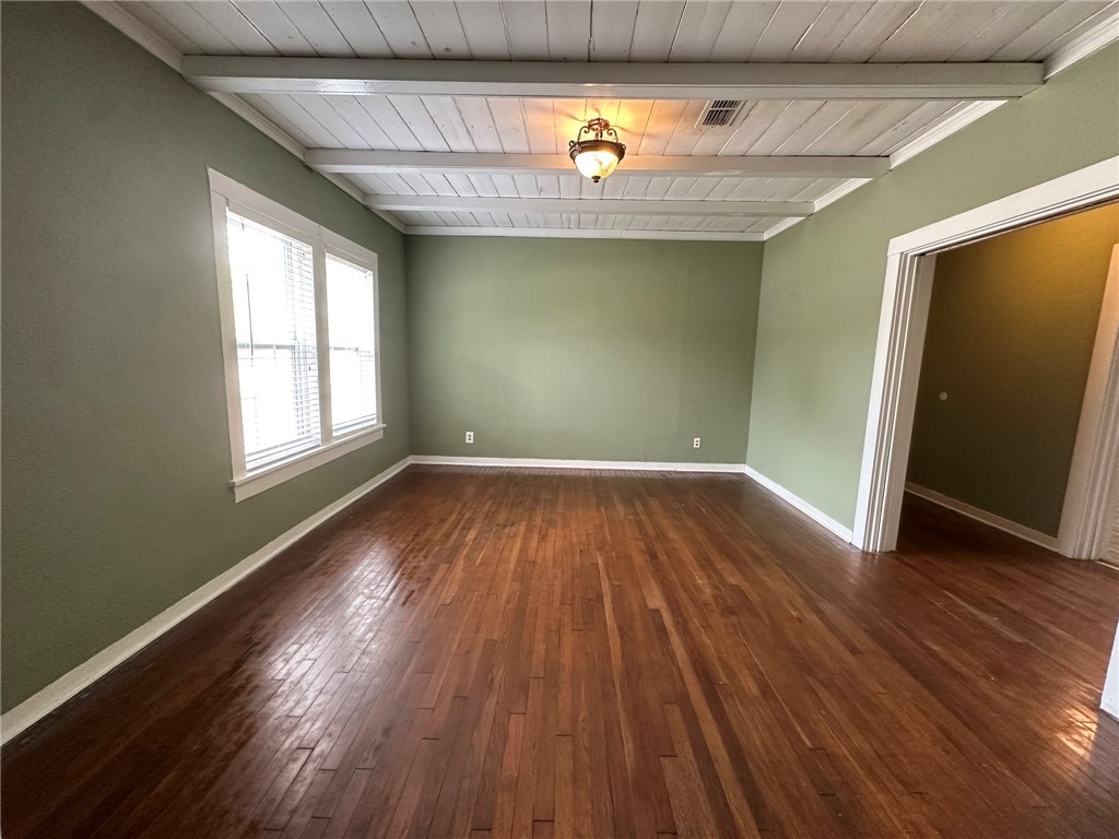 131 Dell Street Portland, TX 78374 - Photo 7 of 40 an empty room with wooden floor and windows