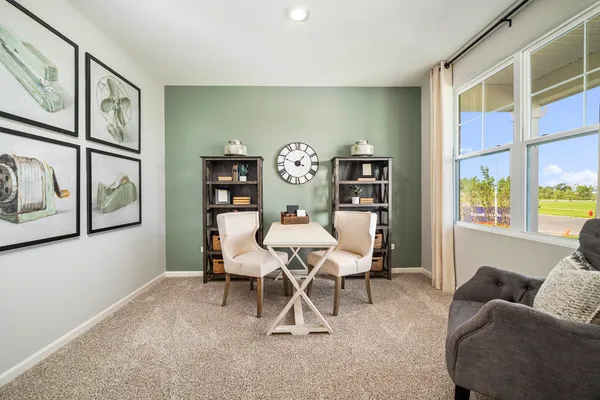 a view of a livingroom with furniture and window