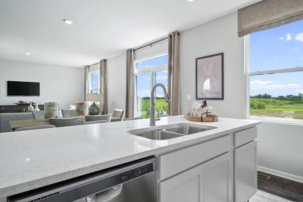 a kitchen with a sink and a window