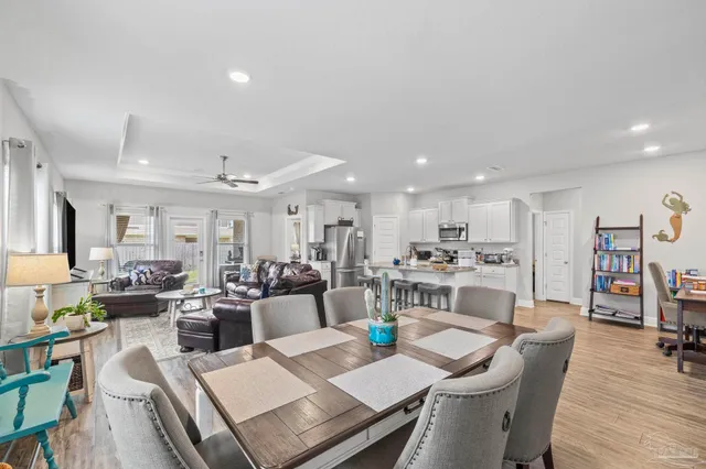 a view of a livingroom with furniture and wooden floor