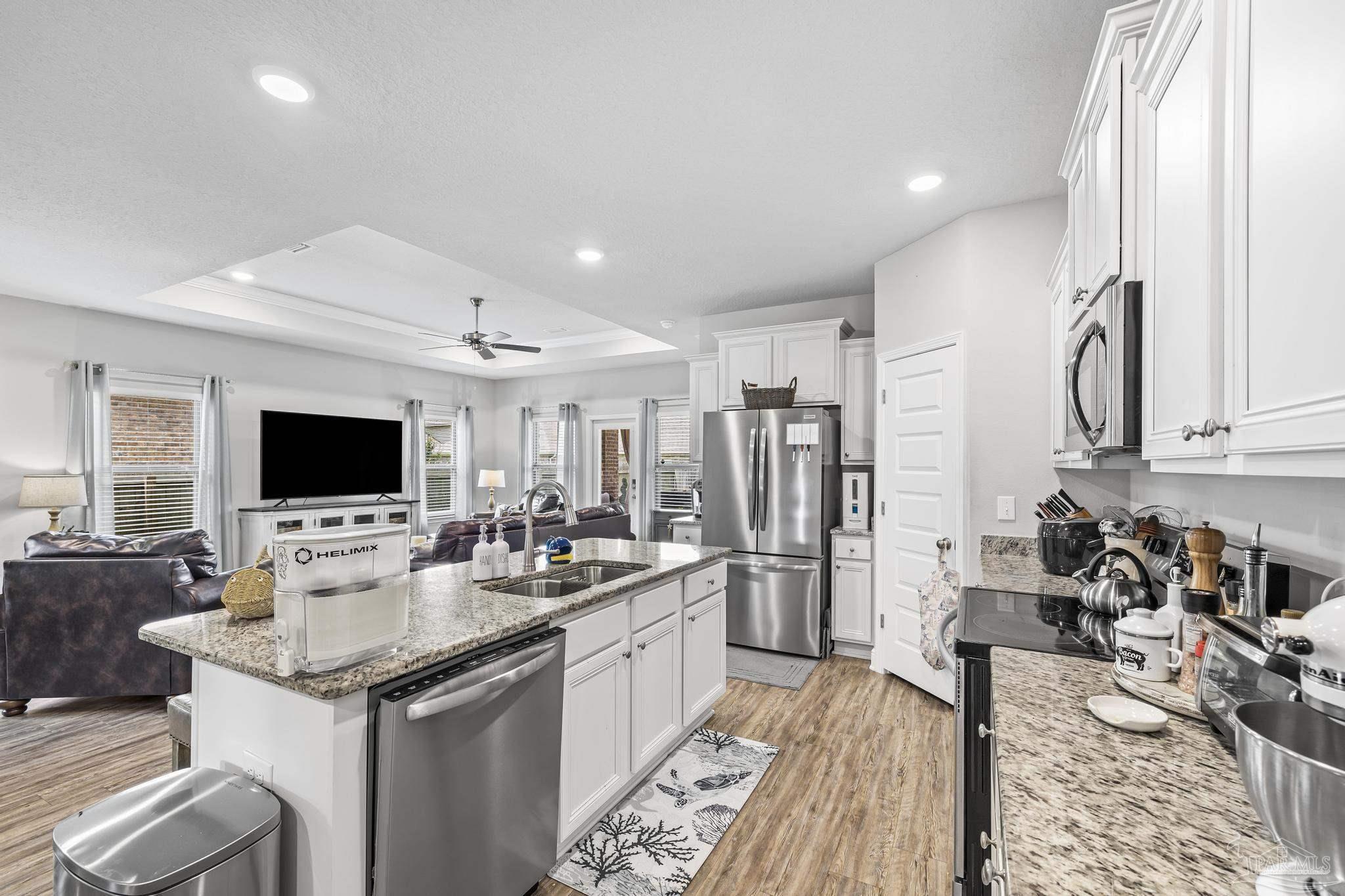5375 Red Shoulder Road Pace, FL 32571 - Photo 16 of 40 a kitchen with a sink and white cabinets