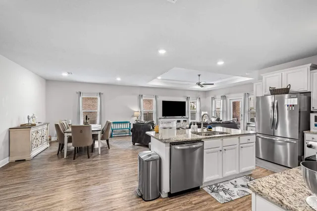 a kitchen with a sink and white cabinets