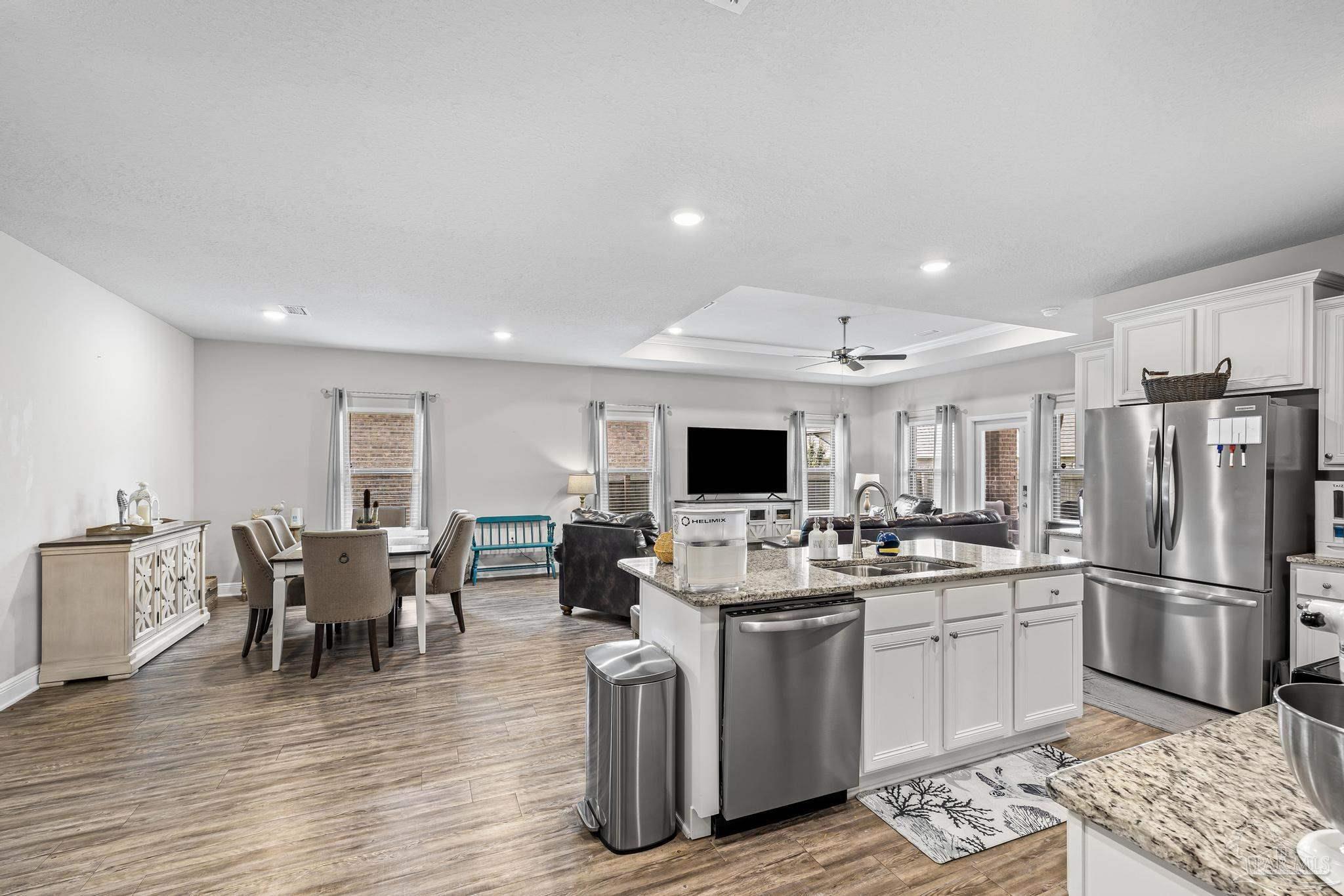 5375 Red Shoulder Road Pace, FL 32571 - Photo 17 of 40 a kitchen with a sink stainless steel appliances and cabinets