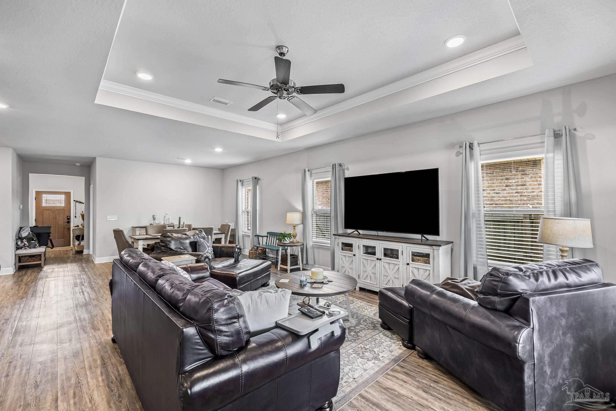 5375 Red Shoulder Road Pace, FL 32571 - Photo 20 of 40 a living room with furniture and a flat screen tv