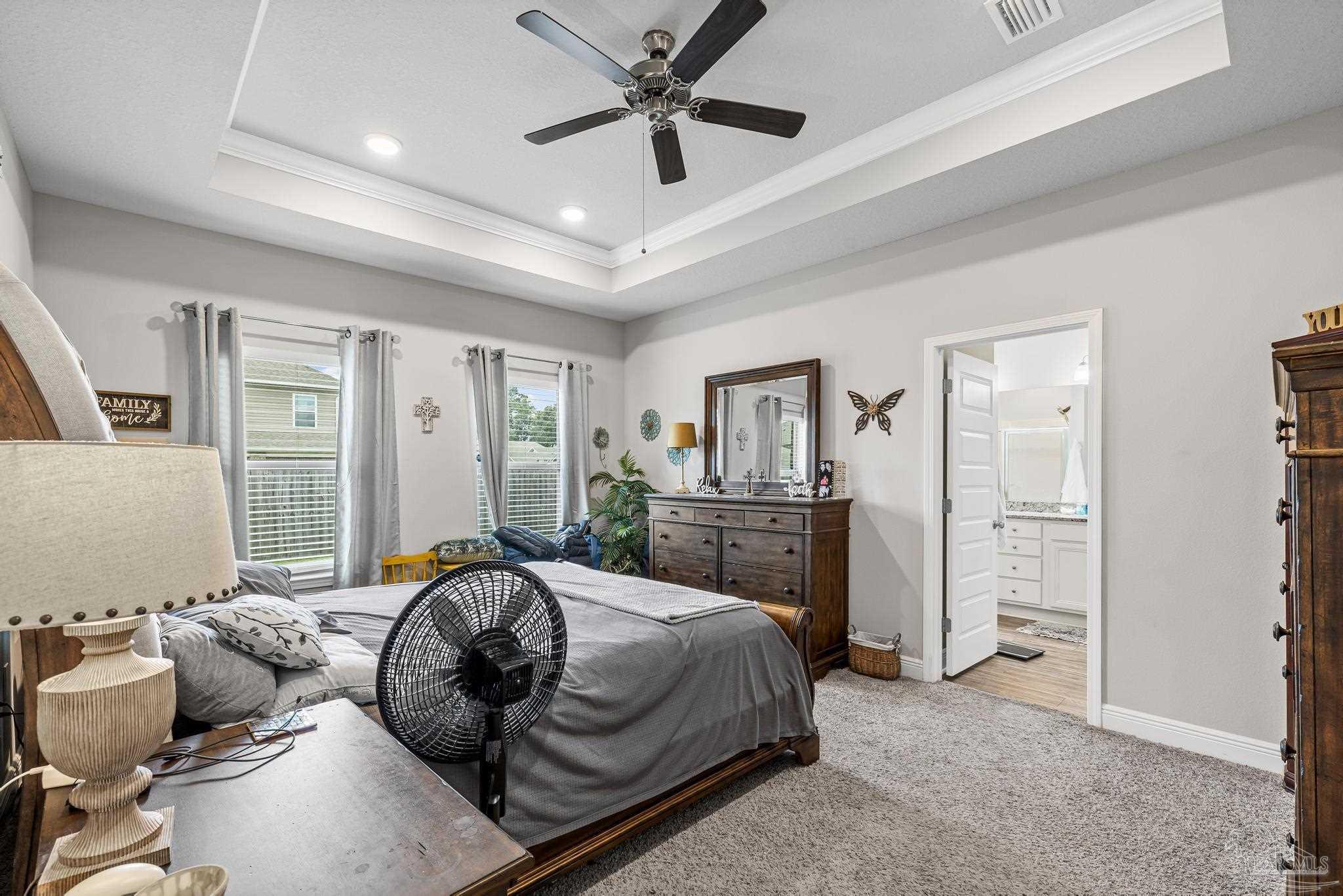 5375 Red Shoulder Road Pace, FL 32571 - Photo 21 of 40 a bedroom with a bed furniture and a window