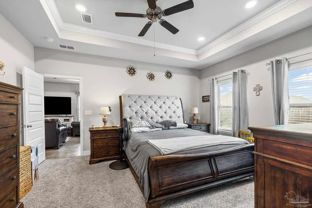 a bathroom with a granite countertop sink a mirror and a bathtub