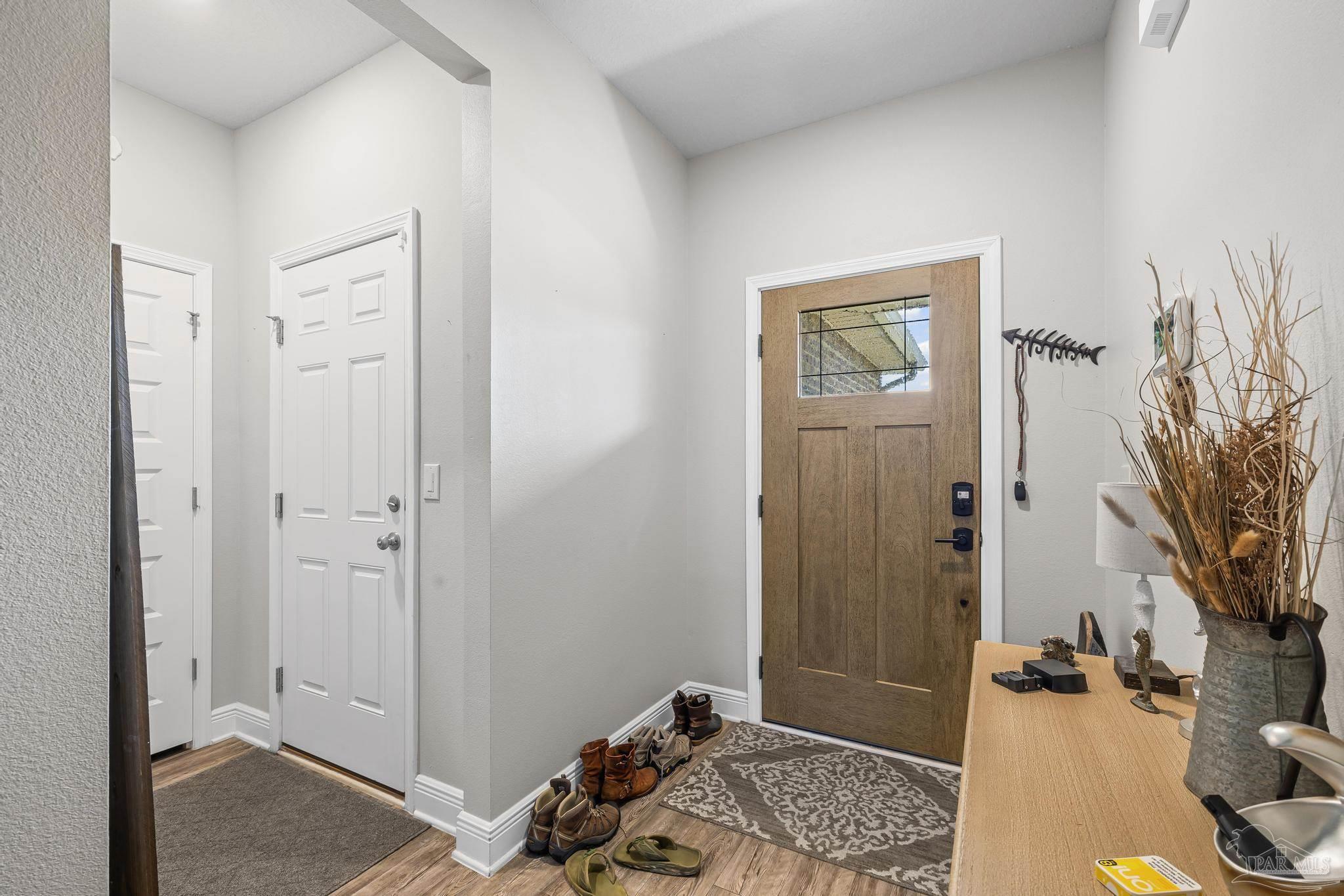 5375 Red Shoulder Road Pace, FL 32571 - Photo 2 of 40 a room that has a bed and a dresser in it