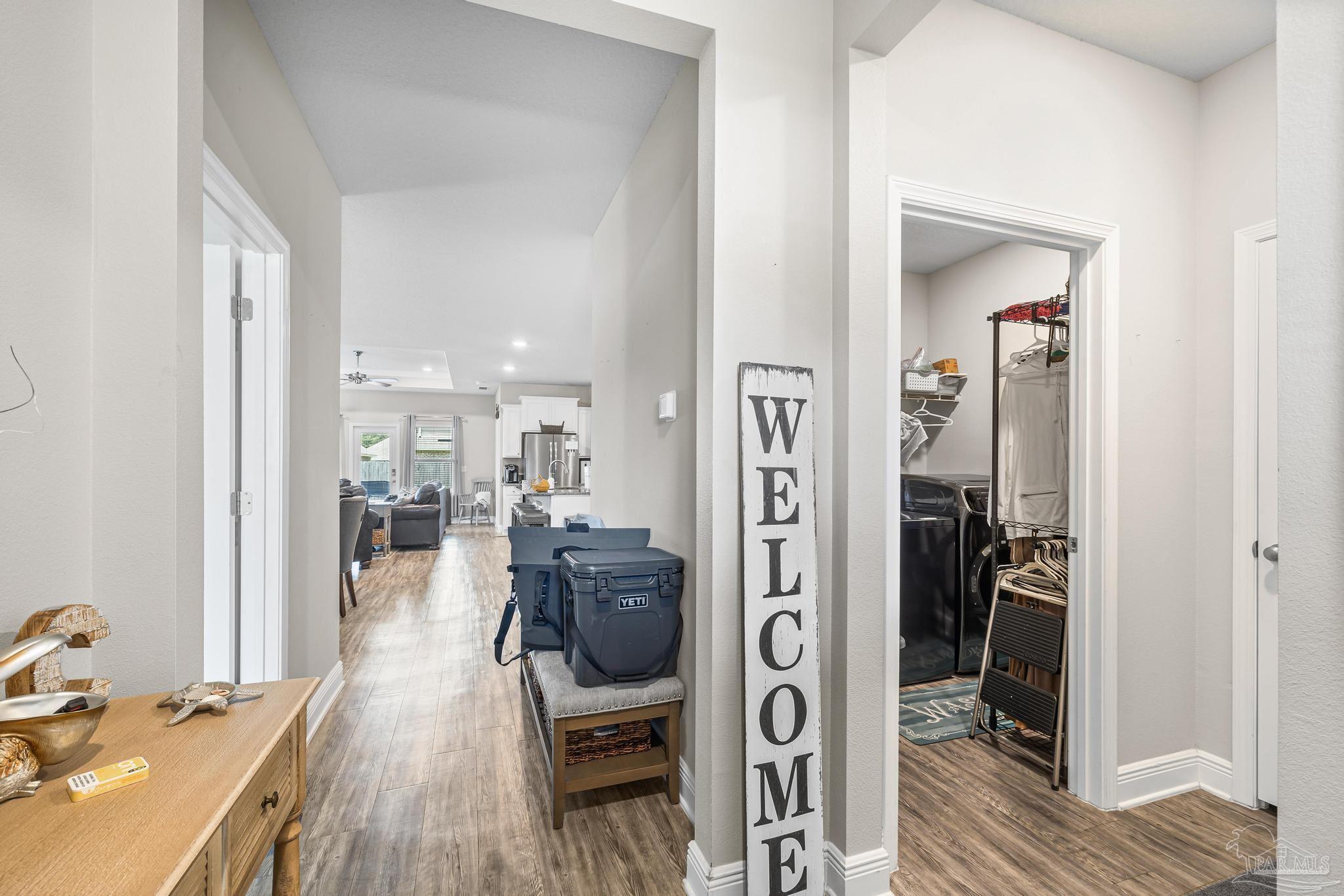 5375 Red Shoulder Road Pace, FL 32571 - Photo 3 of 40 a living room with furniture and a wooden floor